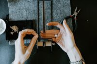 Jewellery artisan working on a contemporary piece in a studio workshop