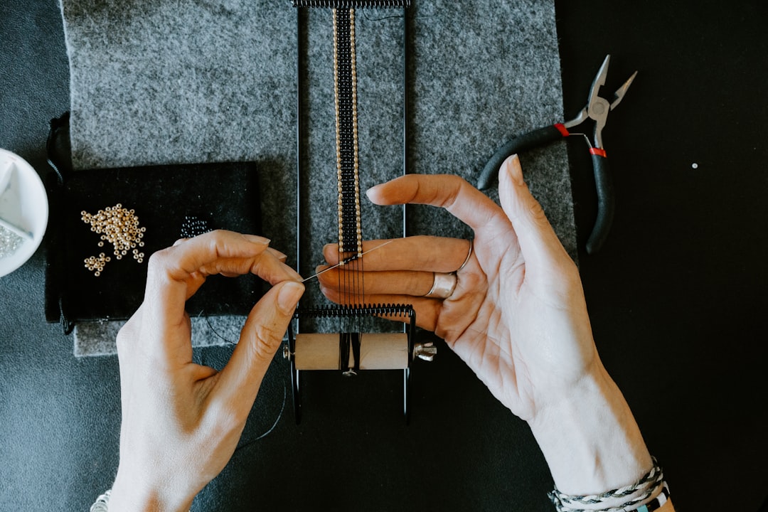 Jewellery artisan working on a contemporary piece in a studio workshop