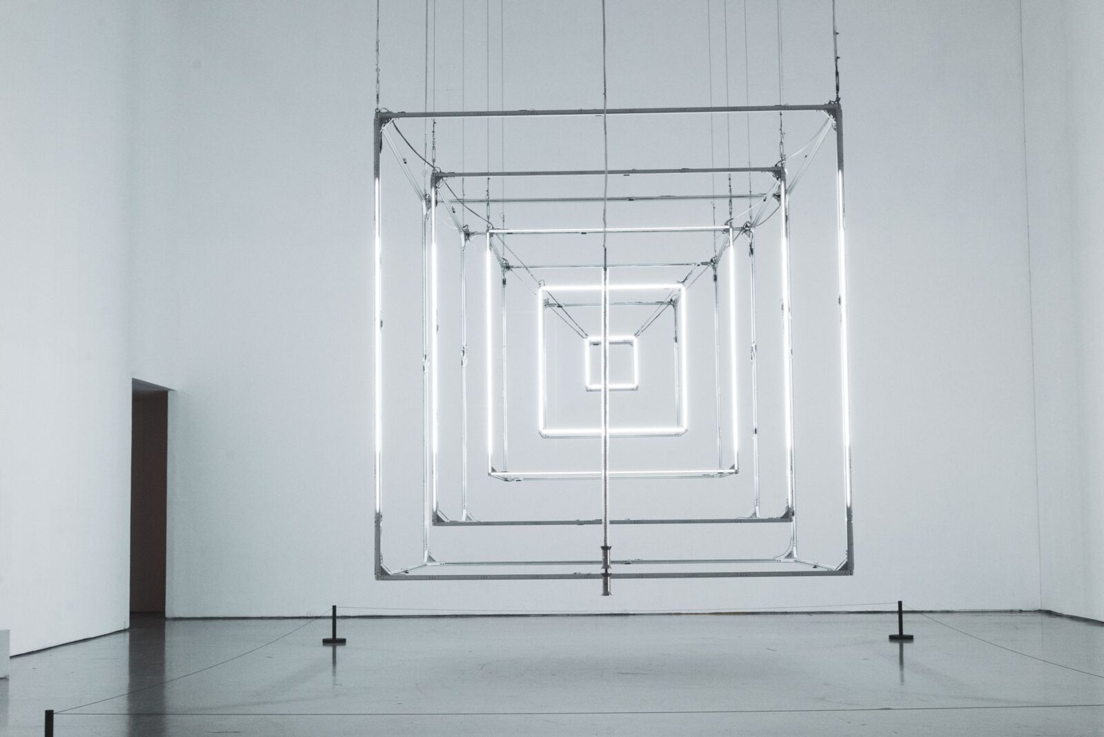 Geometric light installation displayed in a contemporary art gallery